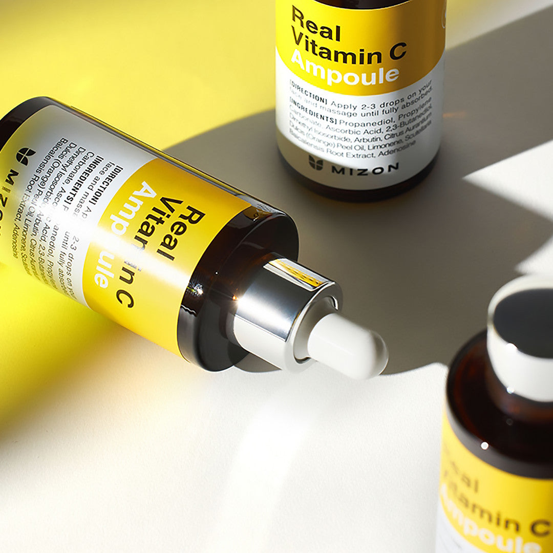Mizon Real Vitamin C Ampoule on grey background