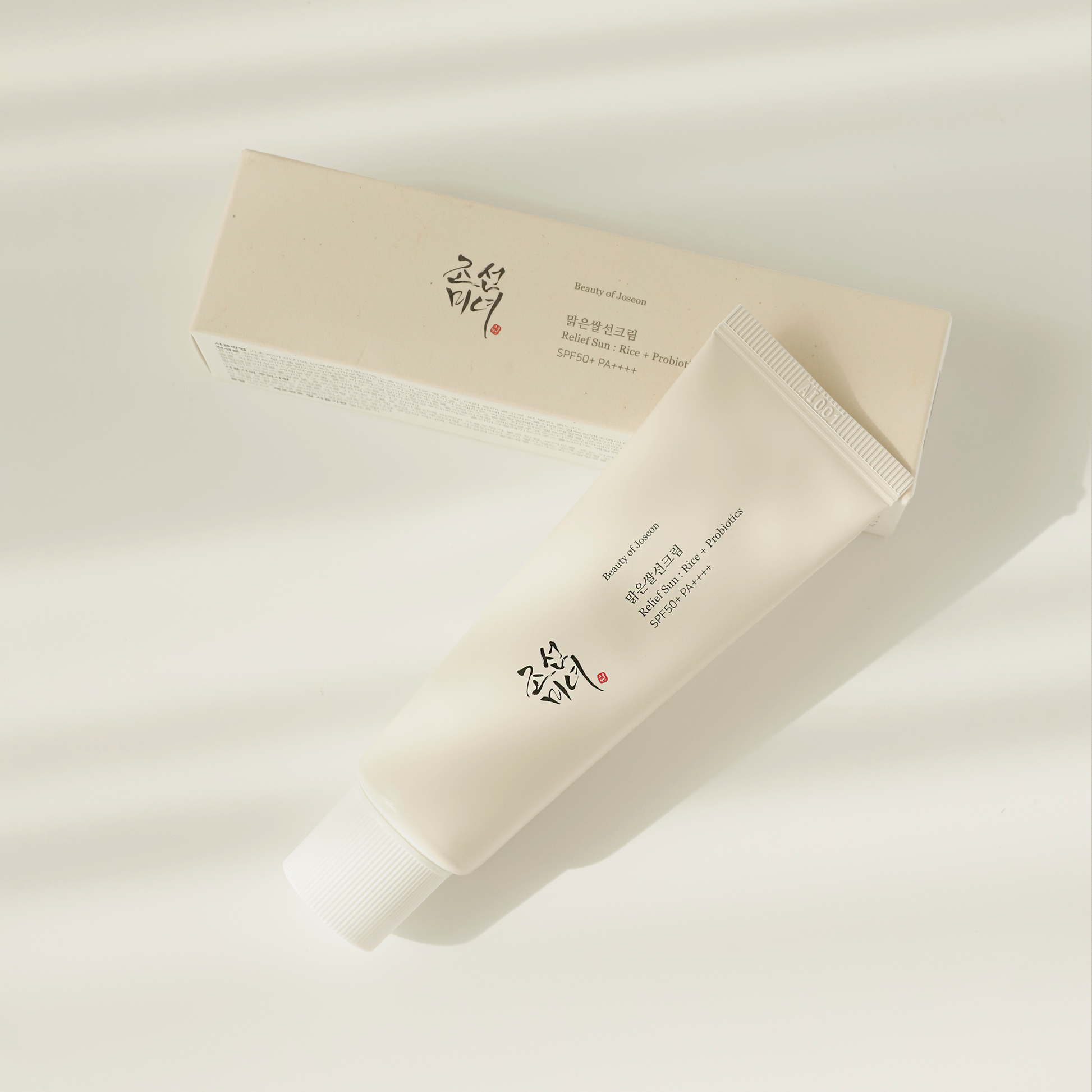 Beauty of Joseon Relief Sun : Rice + Probiotics (SPF50+ PA++++) 50ml with the box on white surface