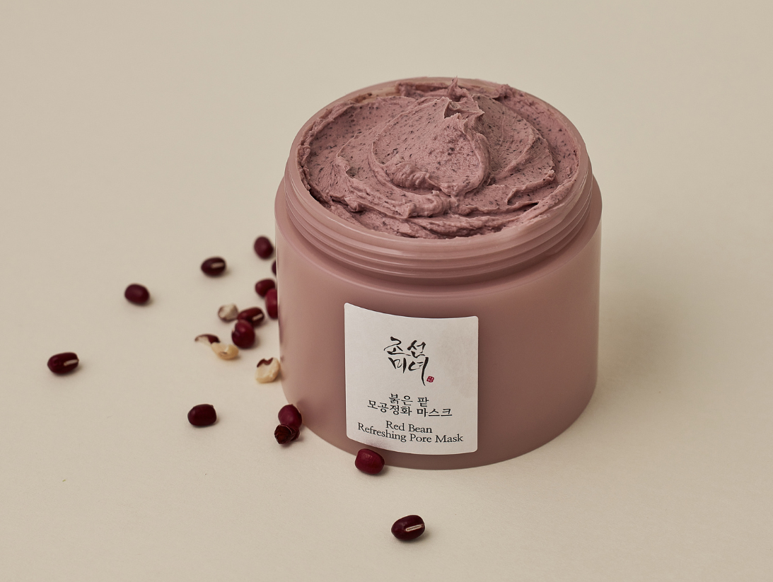 Beauty of Joseon Red Bean Refreshing Pore Mask with lid open and few red beans laying around it